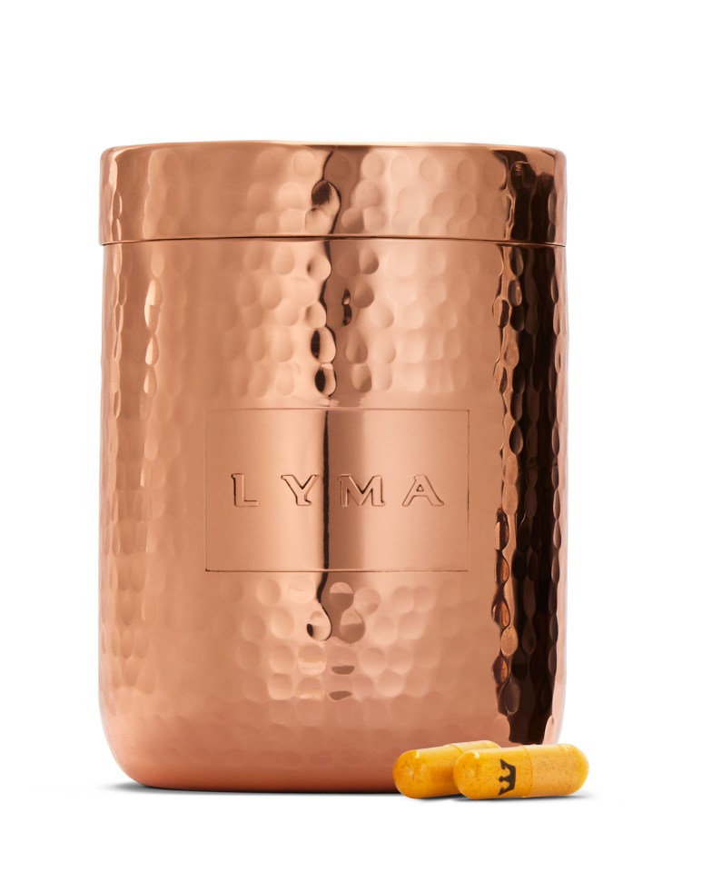 Copper container of Lyma supplements with two capsules in front.