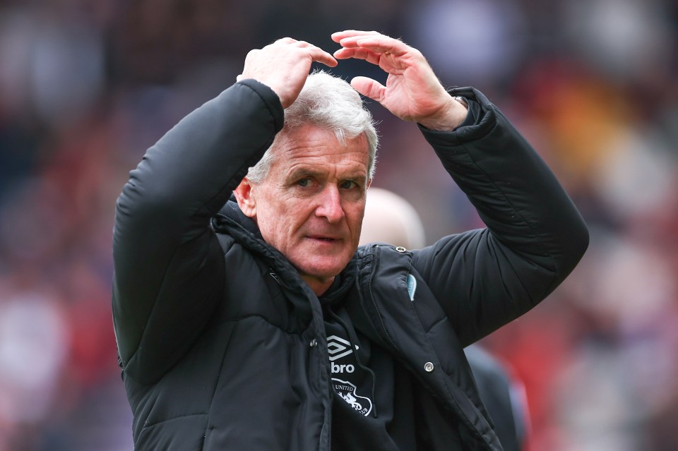 Mark Hughes, manager of Carlisle United, at a soccer match.