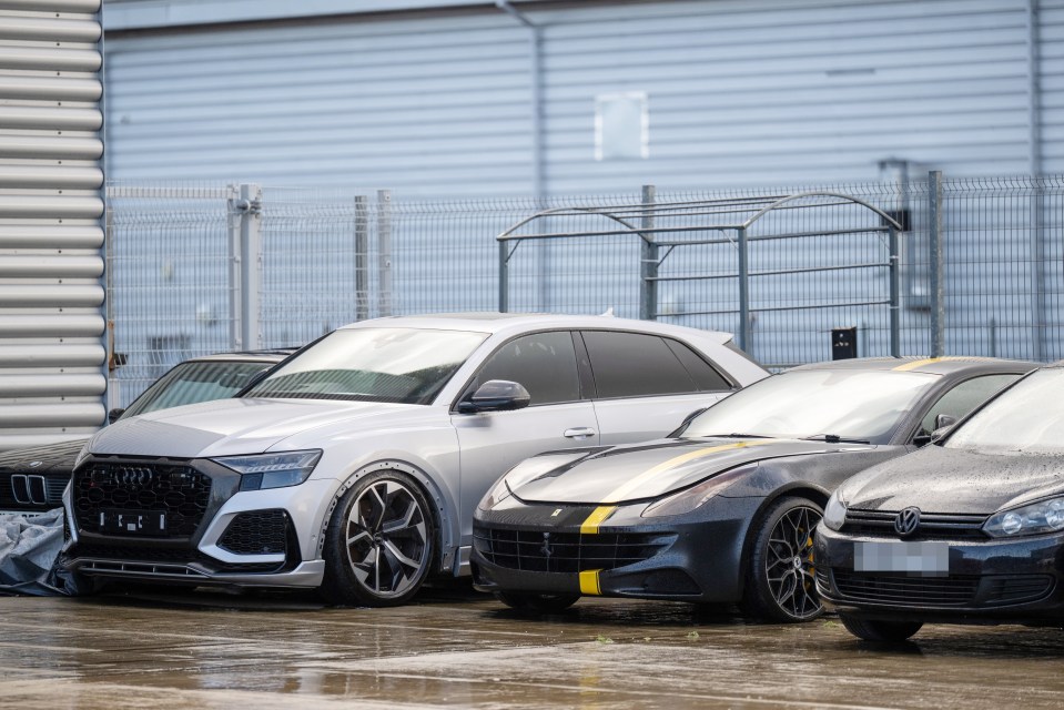 Supercars parked outside a building.