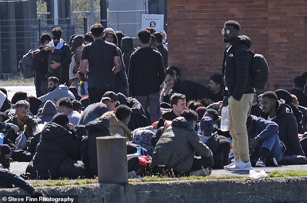 Those gathered sat on a bank in the sunshine at the notorious spot, known as the go-to place to board illegal dinghy's crossing the Channel