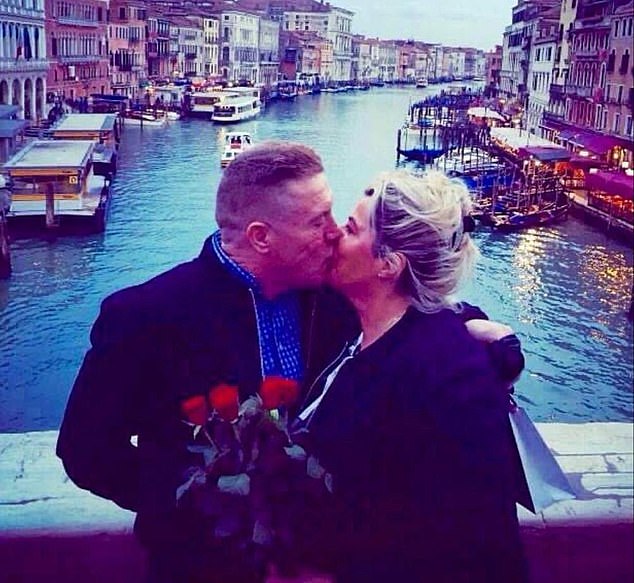 Sharing details of his rich life, Kathleen (pictured kissing Willy on holiday) described him as a charismatic 'gentle giant' who 'loved peace' and was also known affectionately as 'Big Willy'