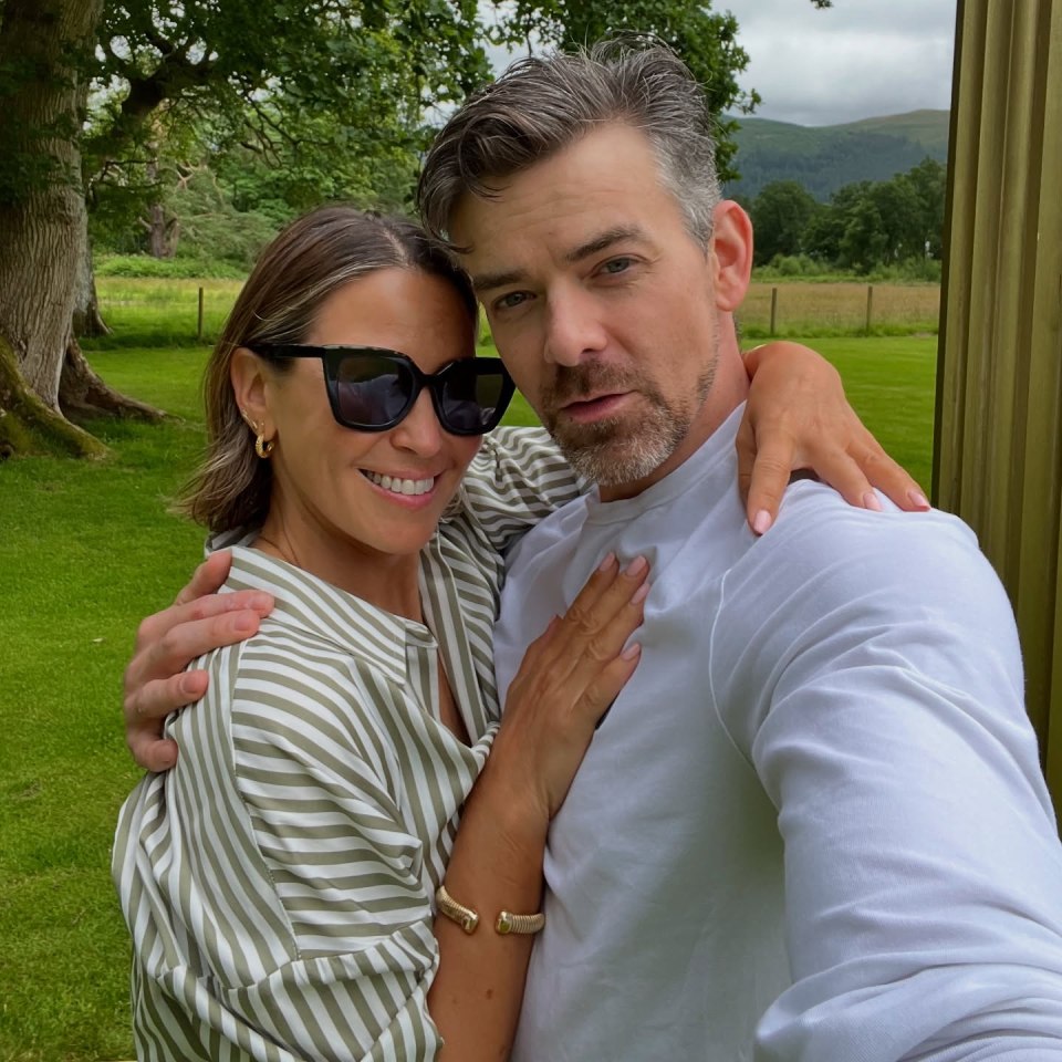 Rachel Stevens and Brendyn Hatfield embracing outdoors.