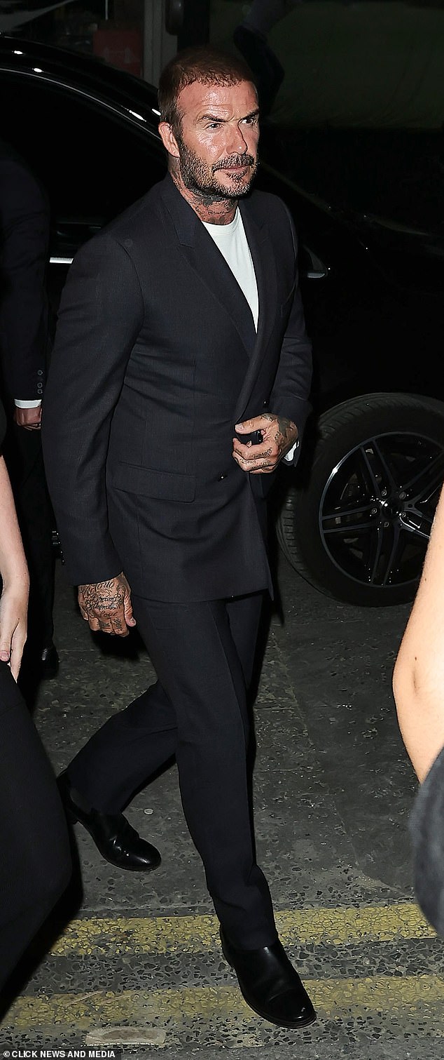 David layered a plain white T-shirt underneath his smart ensemble and sported a pair of black leather shoes as he arrived at the venue