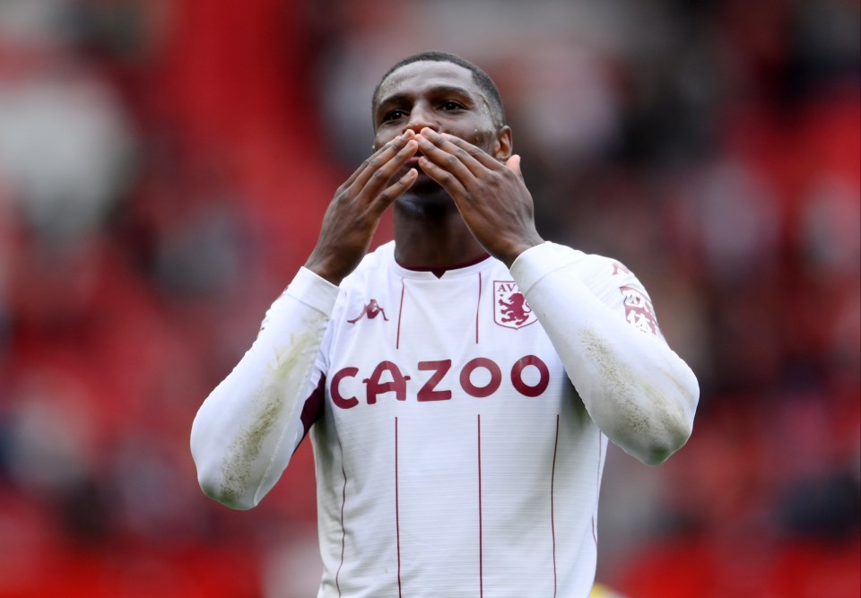 Kortney Hause of Aston Villa celebrating with fans.