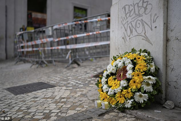 Flowers and candles have been left by wellwishers close to the scene of the crash