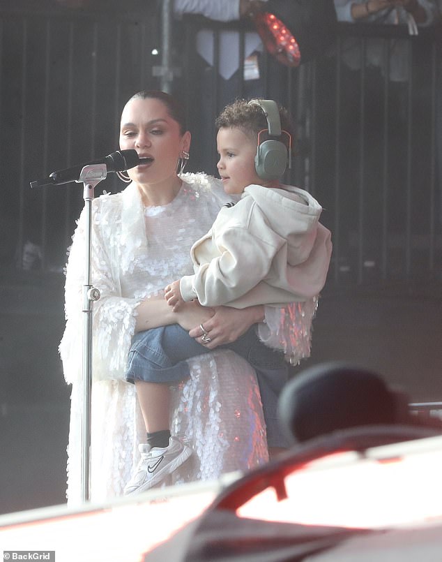 Wearing earmuffs, the singer's two-year-old son Sky joined her on stage as she revealed it was the first time he was seeing her perform