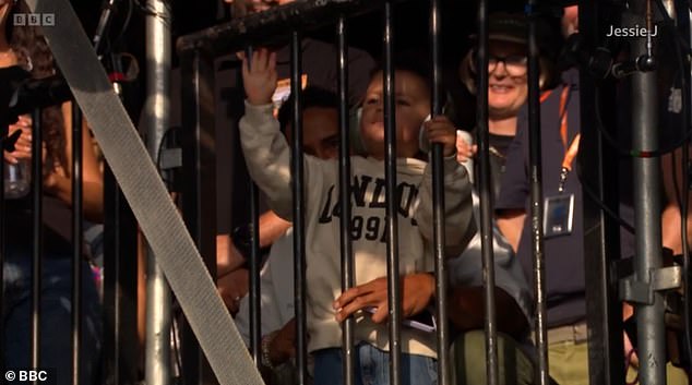 Sky, who is two years old, could be seen backstage wearing earmuffs as he waved at his mum on stage during her set