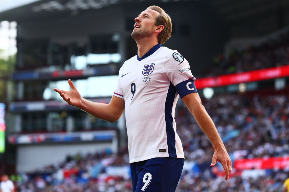 Harry Kane of England looks dejected during a soccer match.