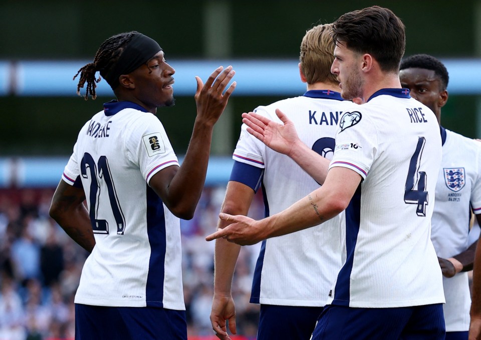 Noni Madueke and Declan Rice celebrating a goal.