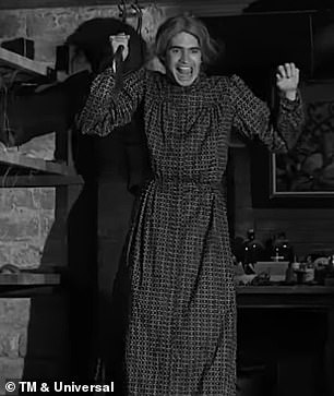 Bates was obsessed with his mother and after she died dressed up like her. He is pictured wearing her clothes and holding a butcher's knife