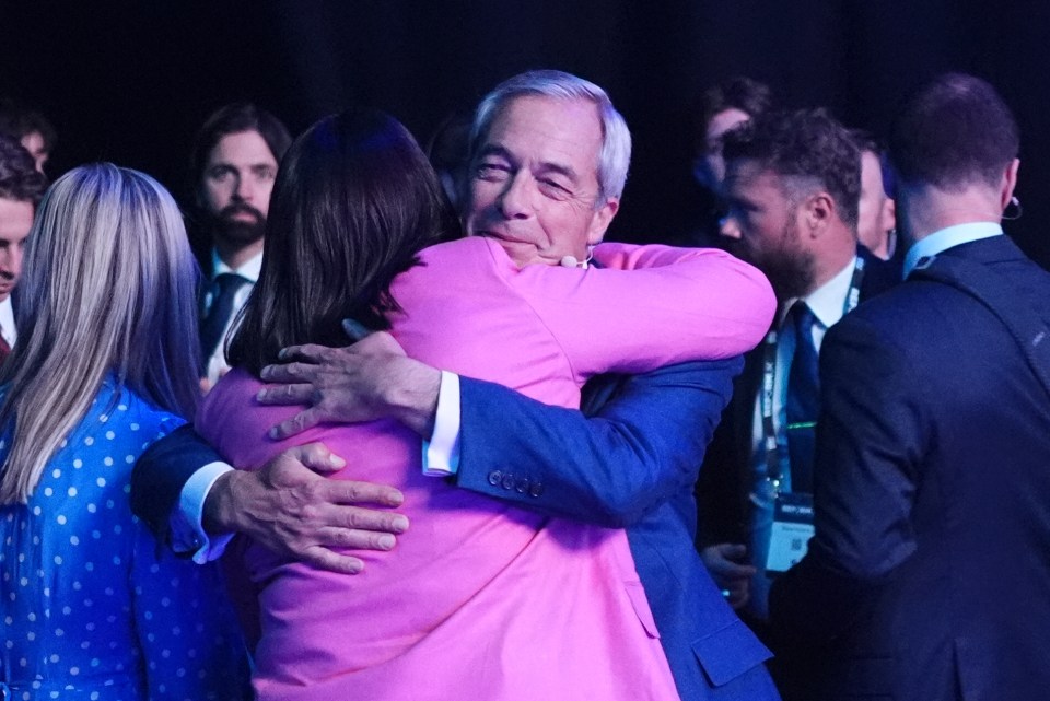 Nigel Farage hugging Lucy Connolly.