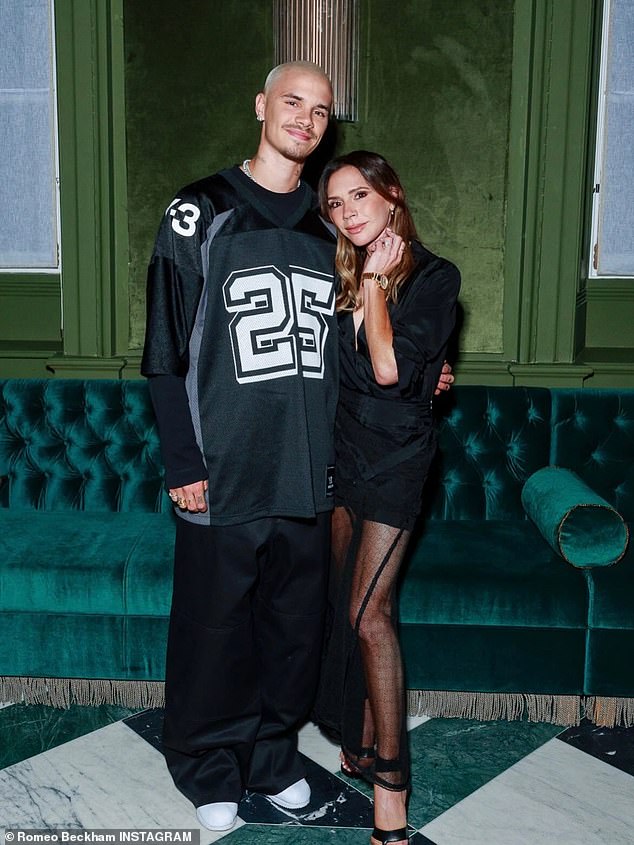 Spice Girl Victoria cut a chic figure in a floor length sheer black gown, while David donned a navy suit paired with a white t-shirt