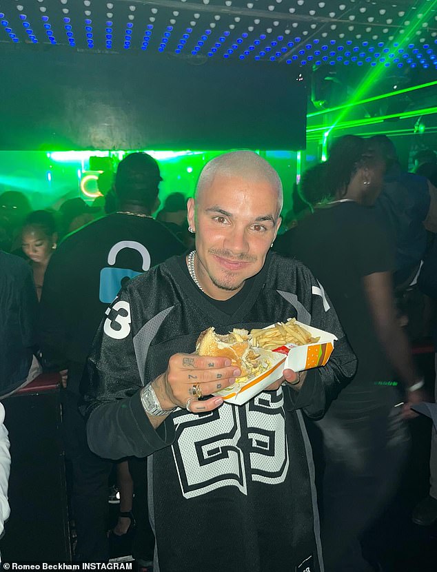 Despite having his party at an exclusive restaurant, Romeo grinned as he tucked into a McDonald's Big Mac during the festivities
