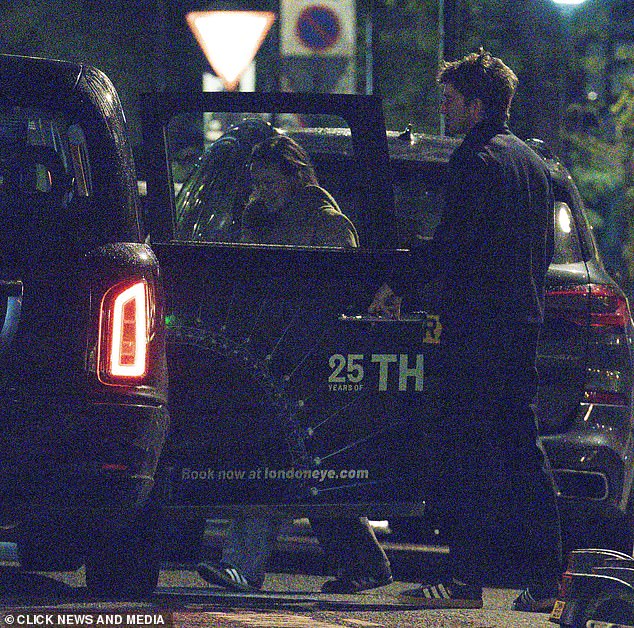 Olivia and Caspar are seen getting into a black cab together