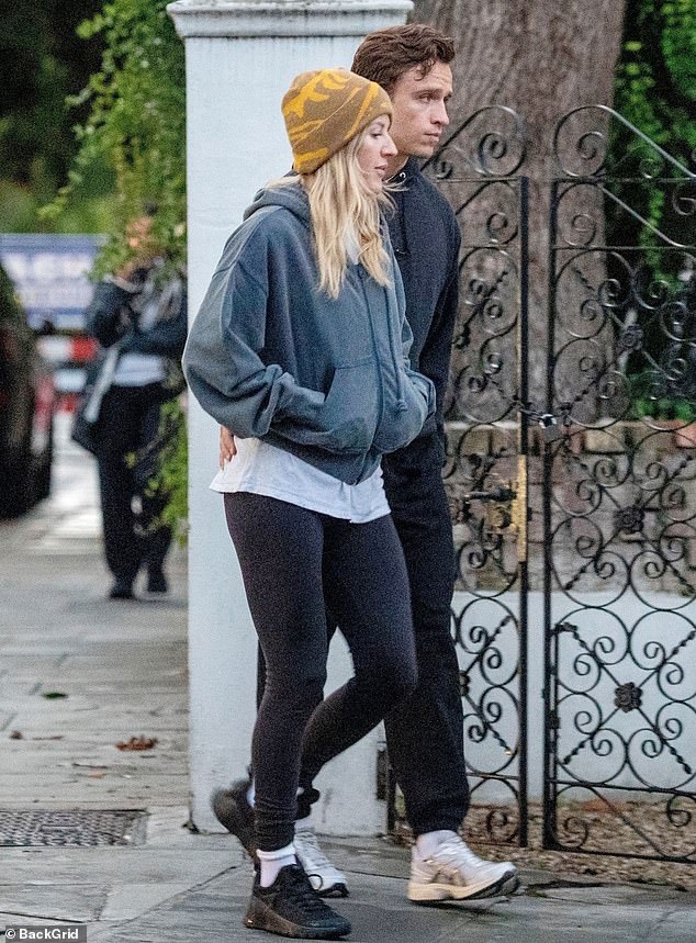 The Burn hitmaker kept comfortable in a pair of black trainers and tucked her hands into her jumper pockets