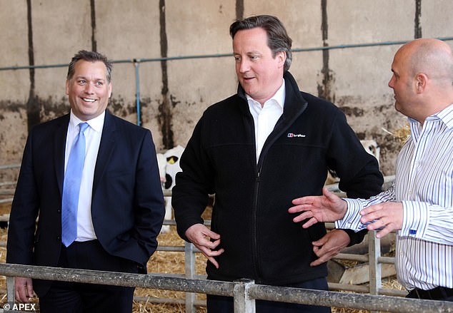 Warburton with then Prime Minister Lord David Cameron in 2022 - before the former was suspended from the party