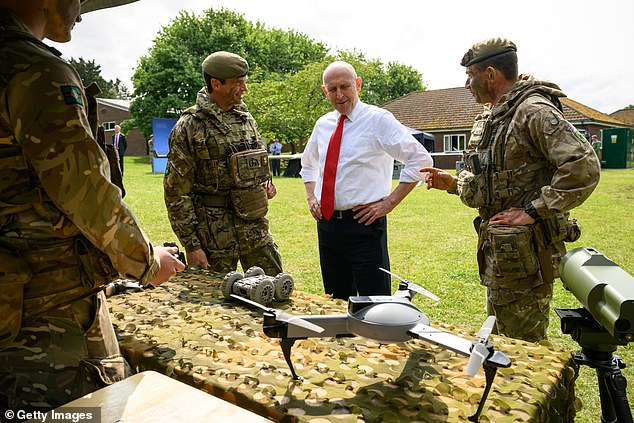 Defence Secretary John Healey (2R) hears a briefing on the use of drone technology as he visits Warminster Garrison on June 3, 2025 in Warminster, United Kingdom