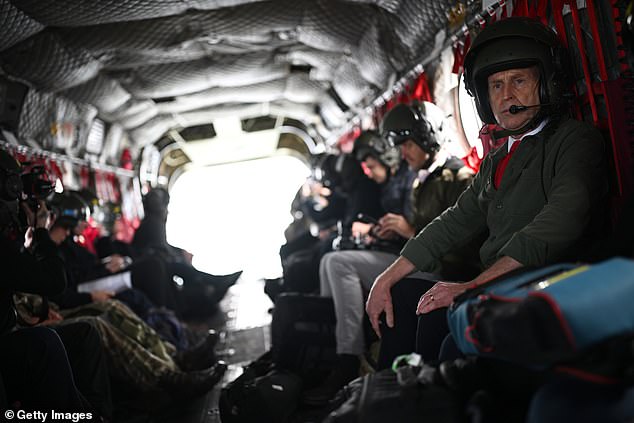 Defence Secretary John Healey speaks with flight crew as he visits RAF Waddington on June 3, 2025 in Northolt, United Kingdom