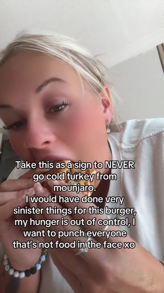 Woman eating a burger after stopping Mounjaro.