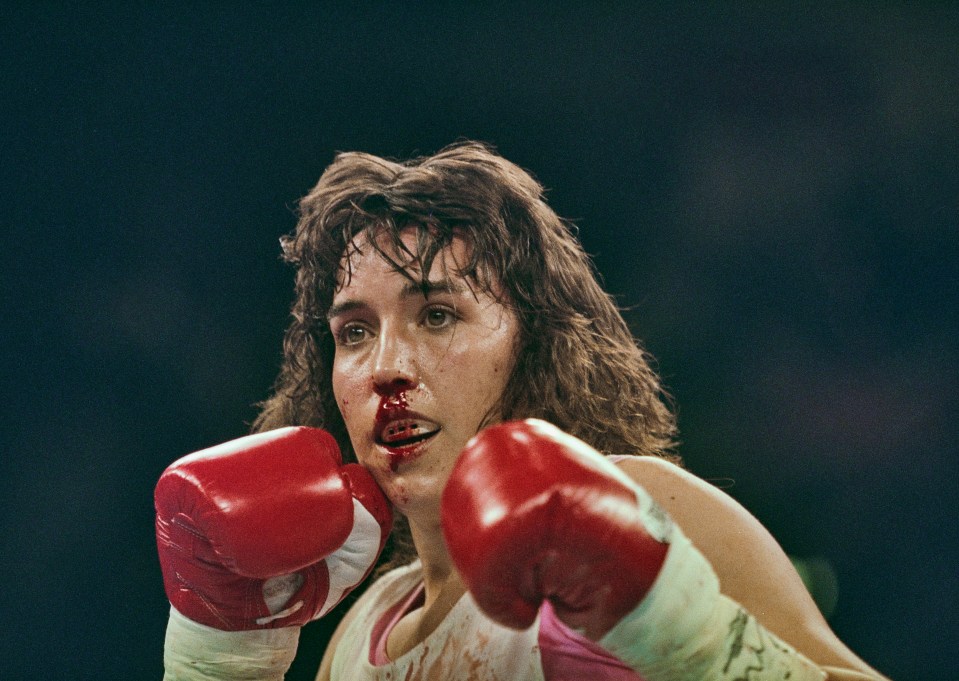 Christy Martin, a boxer, bleeding from the nose during a fight.