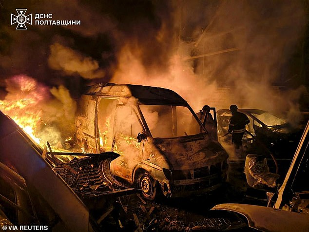 Firefighters work at the site of a transport enterprise hit during Russian drone and missile strikes in Kremenchuk, Ukraine -- September 7, 2025