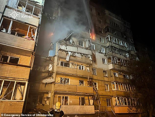 A residential block in Kyiv was heavily damaged in the barrage with firefighters seen battling to put out the flames -- September 7, 2025