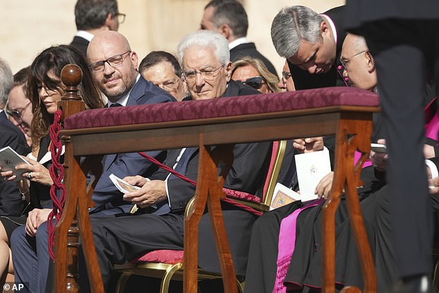Italy's President Sergio Mattarella, center and speaker of the lower house Lorenzo Fontana, left, attend the canonization Mass of Carlo Acutis and Pier Giorgio Frassati in St. Peter's Square at the Vatican Sunday, Sept. 7, 2025