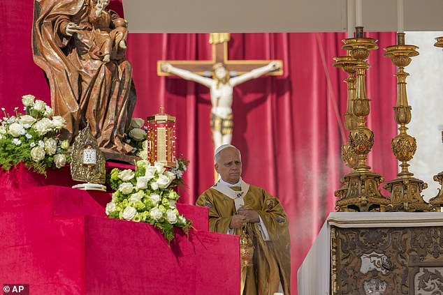 Relics of Carlo Acutis and Pier Giorgio Frassati, left, are displayed during their canonisation Mass celebrated by Pope Leo XIV in St. Peter's Square at the Vatican Sunday, September 7, 2025