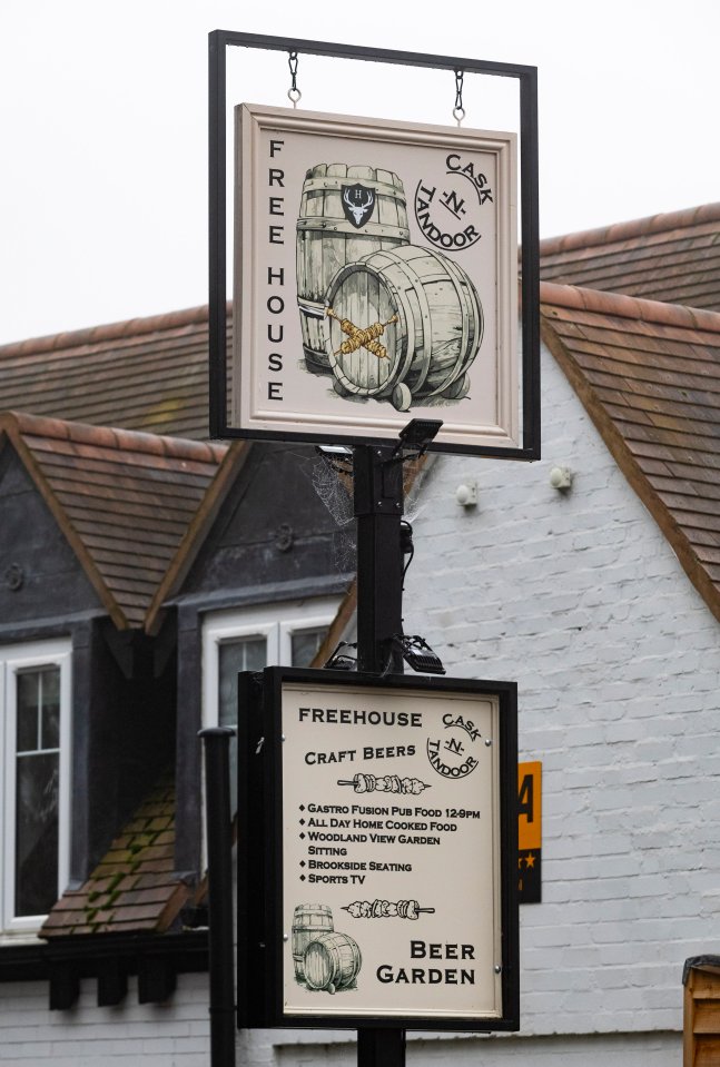 Pub sign for The Cask N Tandoor, showing craft beers and pub food.