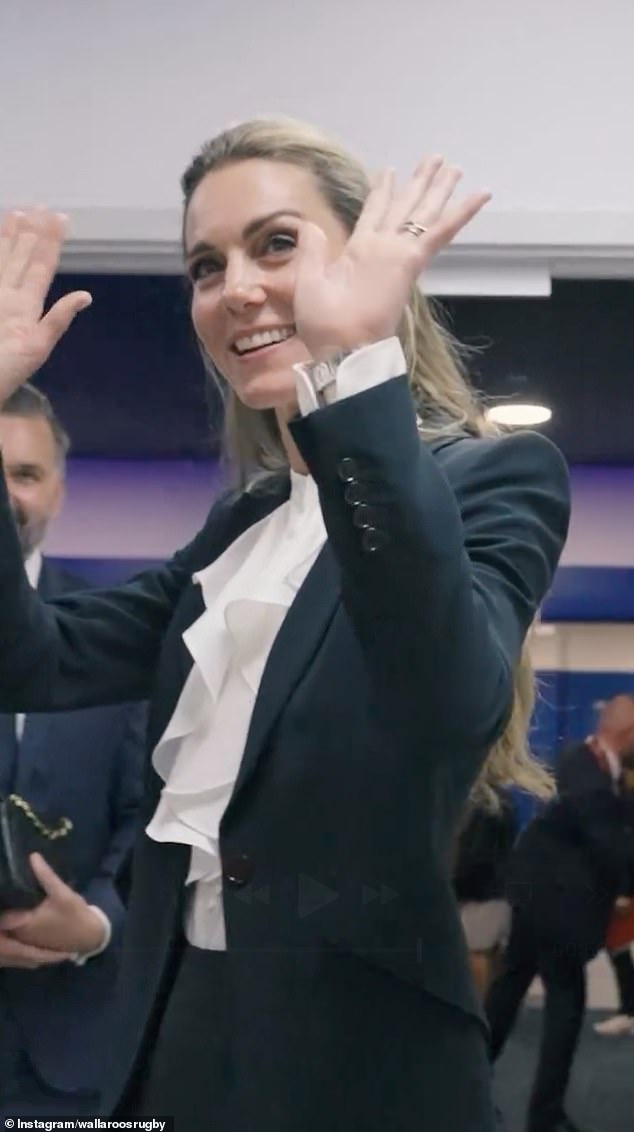 The princess turned around, waved, and blew the team a kiss before disappearing out of the changing area