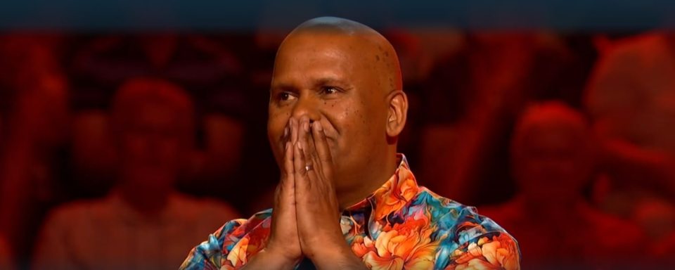 A contestant on Beat the Chasers reacting to losing a large sum of money.