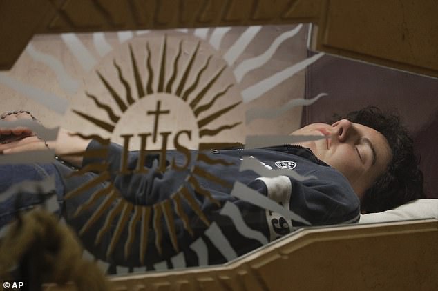 Carlo Acutis, an Italian boy who died in 2006 of leukemia, lies in state ahead of being beatified by Cardinal Agostino Vallini, in Assisi