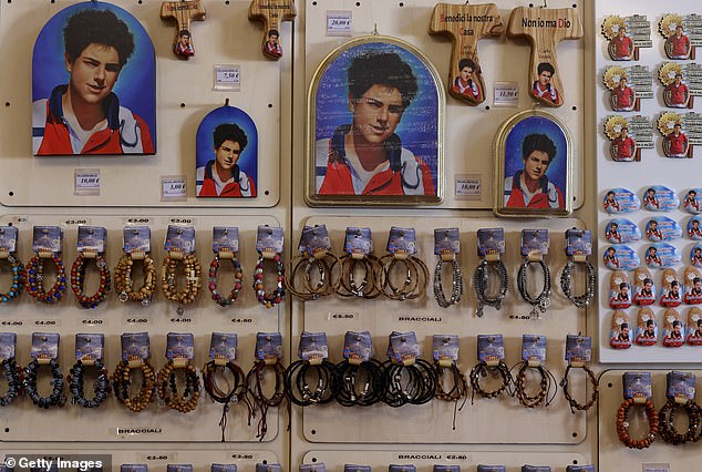 Souvenirs and mementos of the Blessed Carlo Acutis for sale in a shop in Assisi