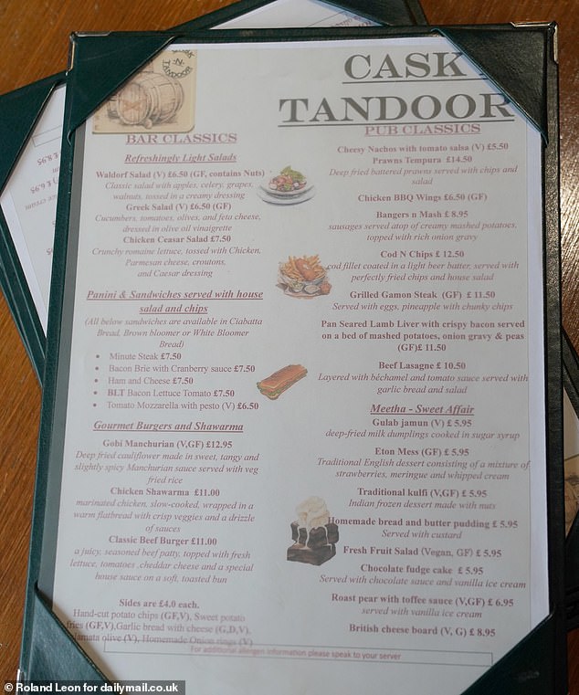 'Our Indian Gastro Pub, blessed with a scenic view of the woodland and the soothing murmur of a nearby brook, is more than just a pub', it continues. Pictured: The Cask N Tandoor menu