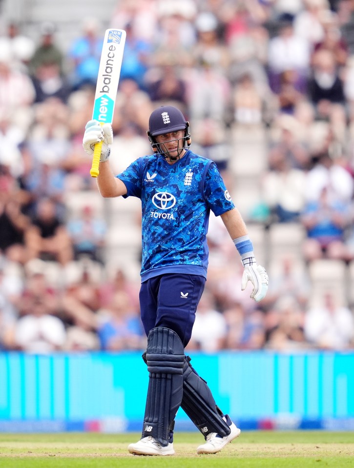 Joe Root celebrates a half-century during a cricket match.