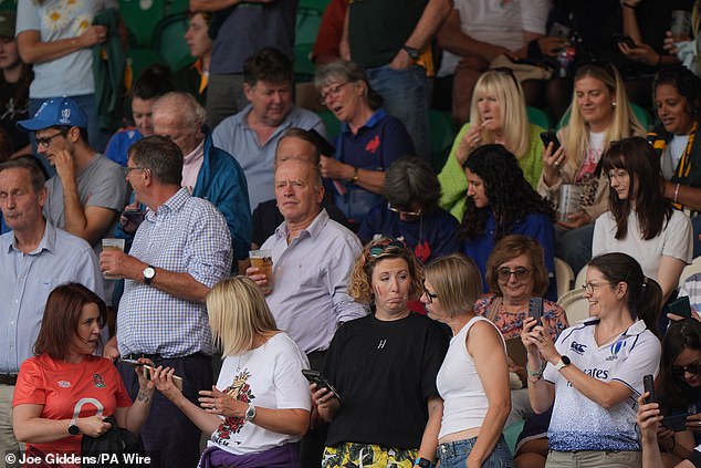 Fans in the stand react as the emergency national alert system test goes off, during the Women's Rugby World Cup 2025 pool D match at cinch Stadium at Franklin's Gardens