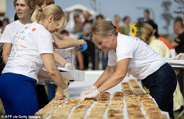 During the village's traditional festival, the strudels, made following a traditional recipe, were laid across several tables placed in a star formation by locals and volunteers