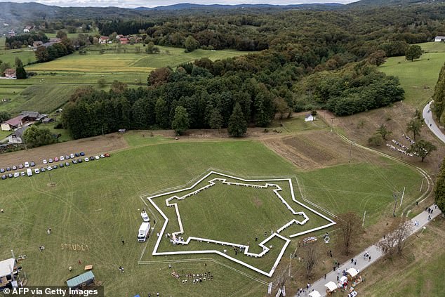 Aerial view of a field and tables laid out in star formation for the strudels during the Guinness World Record attempt for the world's largest strudel line, in the village of Jeskovo near Karlovac
