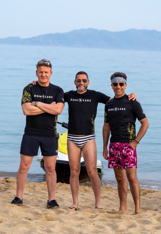 Gordon Ramsay, Fred Sirieix, and Gino D'Acampo on a beach in Crete.