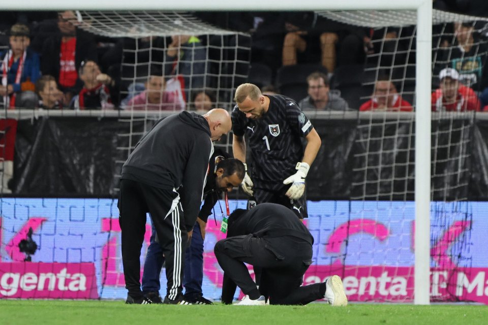 Injured soccer player attended to by medical staff.