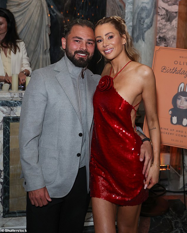 Olivia spoke exclusively to the Daily Mail for the first time since the pictures emerged about her 'challenging' six months with husband Bradley Dack (pictured together in May)