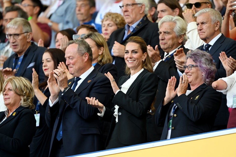 Princess Catherine clapping with other attendees at a rugby match.