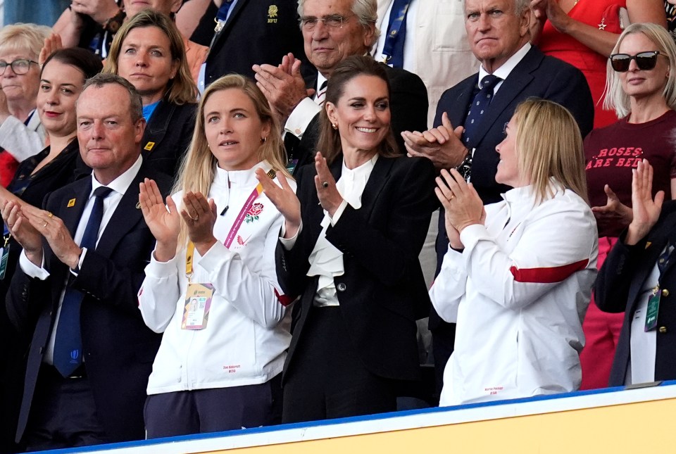 Catherine, Princess of Wales, clapping at a rugby match.