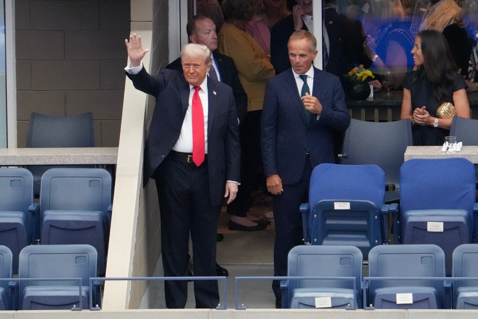 Donald Trump waving at the US Open.