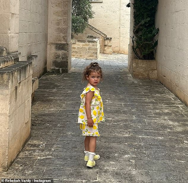 Rebekah looked nothing short of sensational in a canary yellow maxi dress for one family snap and declared they already 'felt at home'