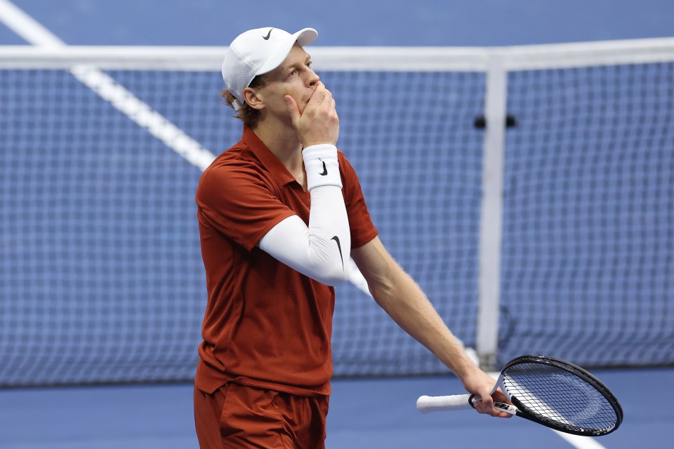 Jannik Sinner reacting during a tennis match.