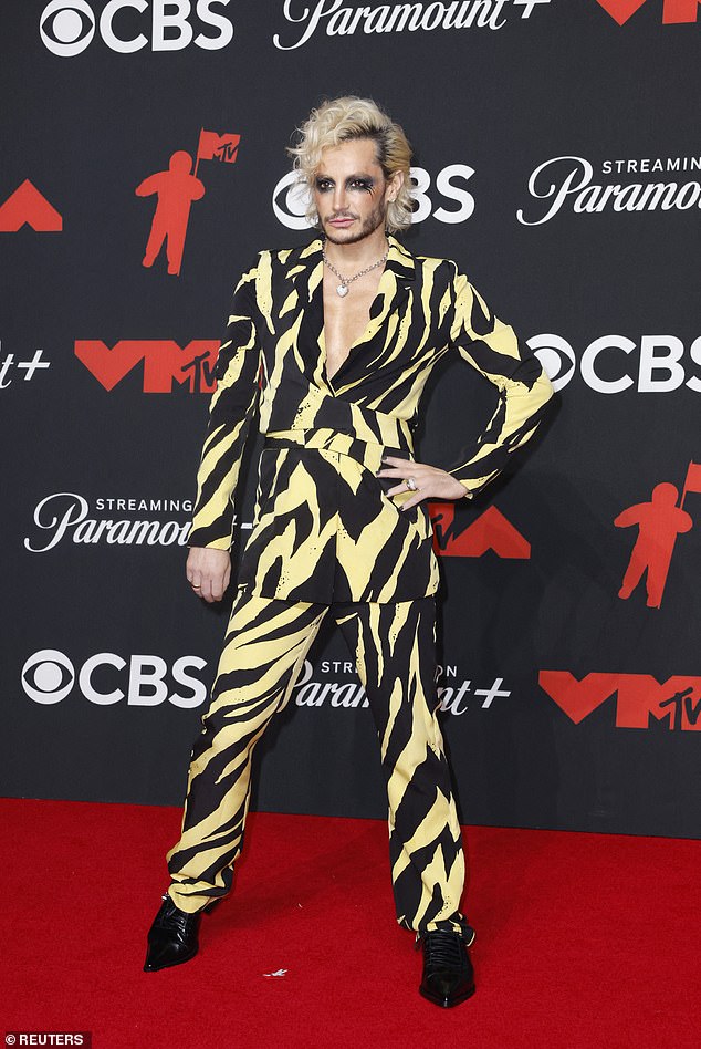 Franke Grande was seen at the event in a yellow and black striped suit. The bright pattern ensured all eyes would be on him... but not for the right reasons
