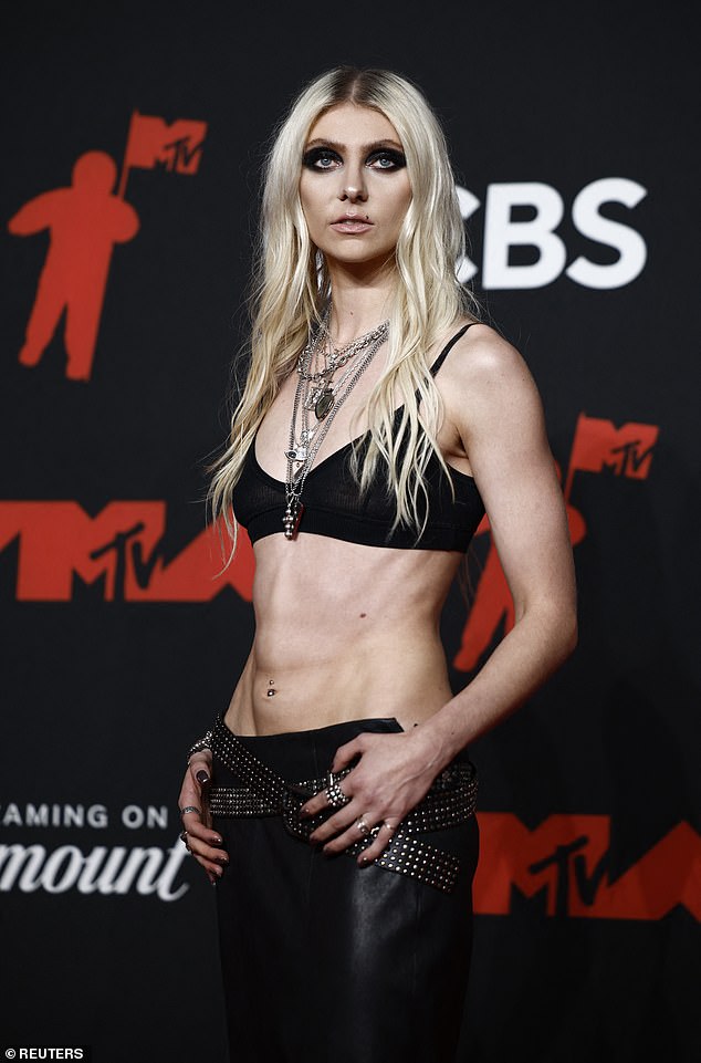 She accessorized with a studded belt