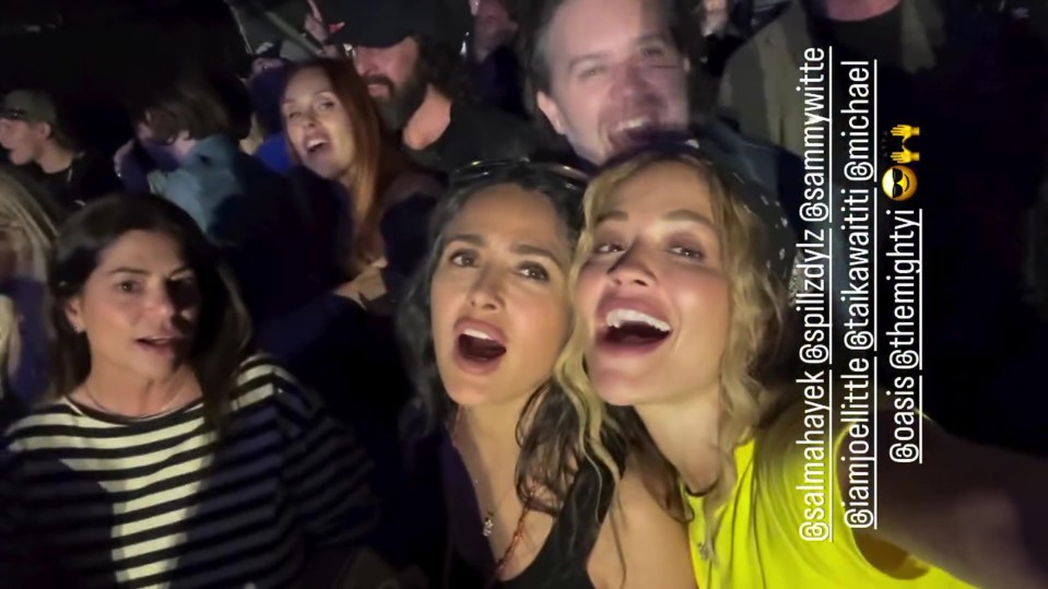 Rita Ora, Taika Waititi, Kristen Stewart, and Salma Hayek at an Oasis concert.