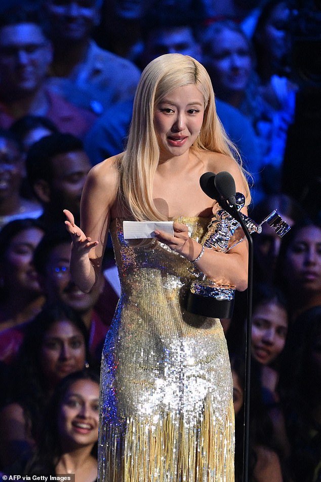 The 28-year-old New Zealand-South Korean singer-songwriter Rosé was emotional as she teared up while accepting the honor as Bruno was not in attendance